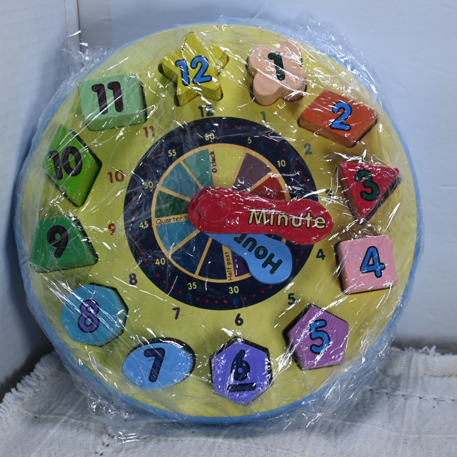 Melissa & Doug shape sorting clock to teach shapes and how to tell time