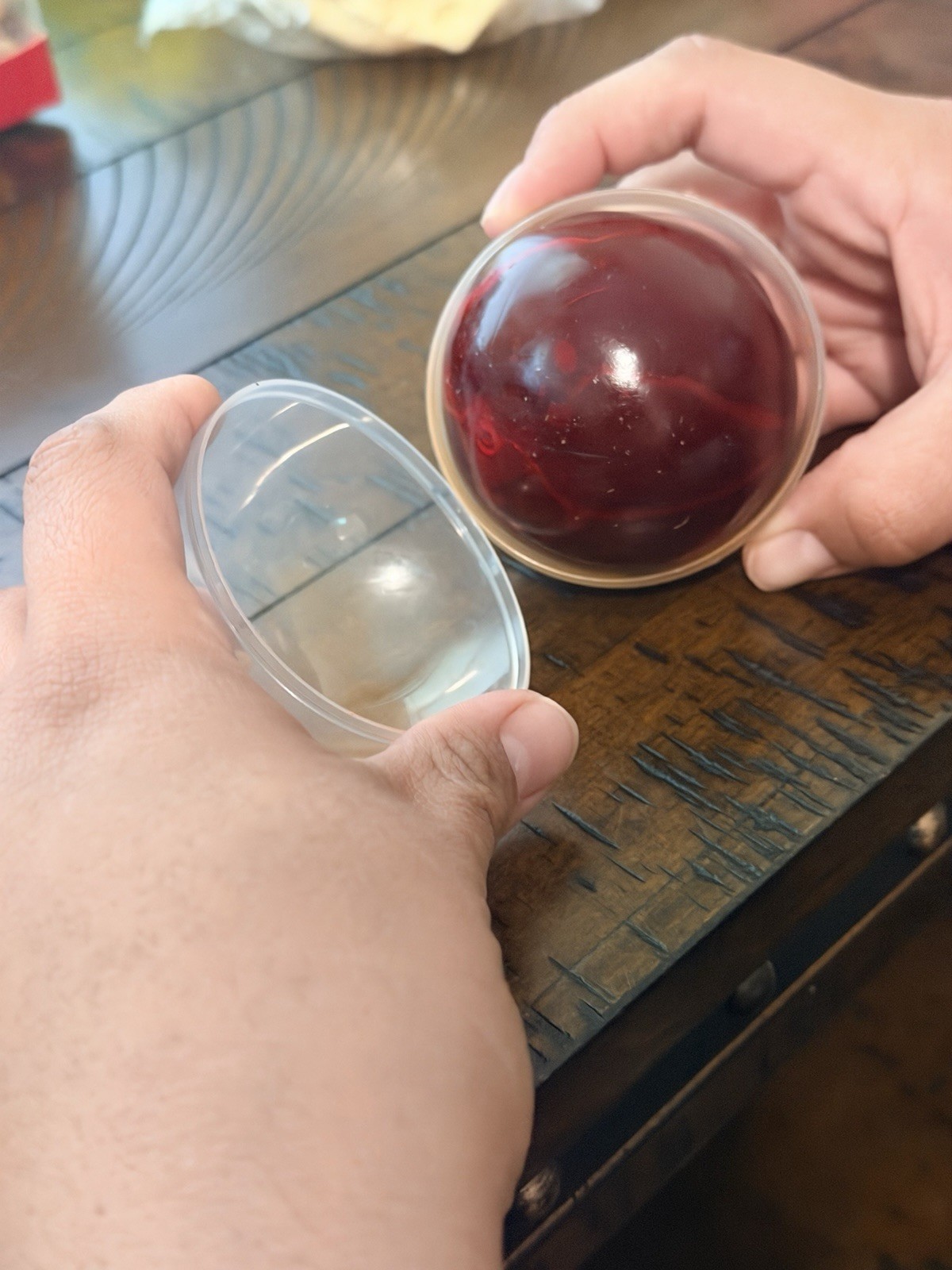 Red squeeze wax squeeze ball in Clear Plastic Display Case