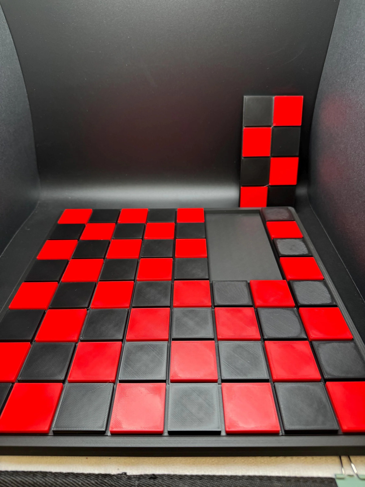Checkerboard Dissection Puzzle – Battle Royale by Sam Loyd